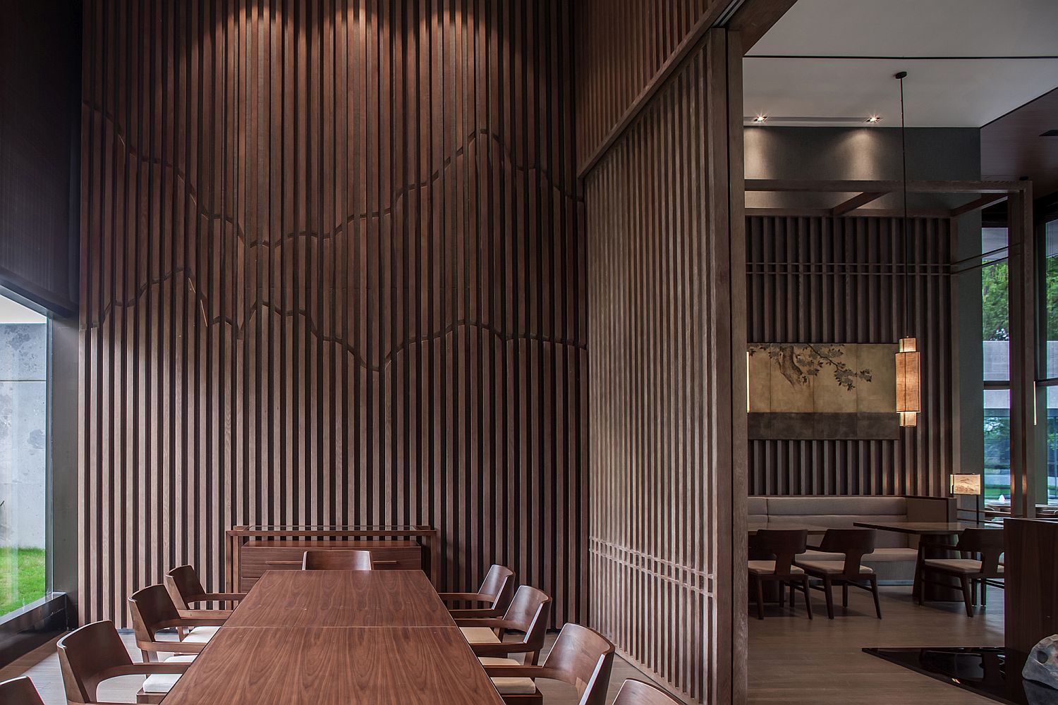 Vertical wooden slats bring the image of forest indoors