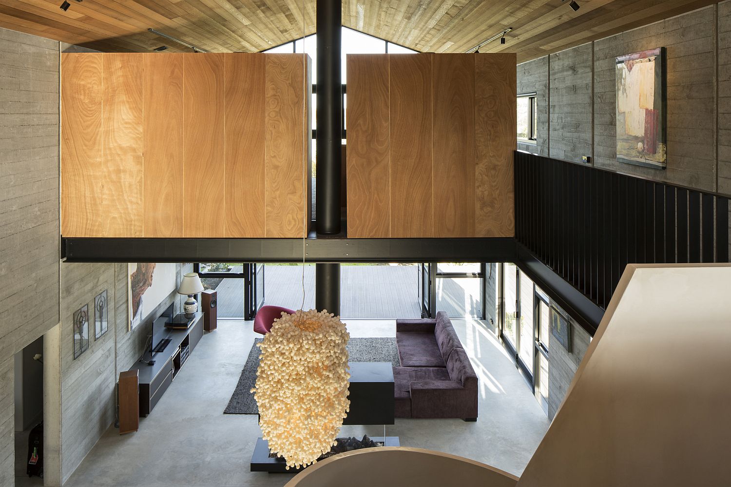 View of the double height living area from the mezzanine level