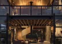 Wall-of-glass-windows-and-doors-opens-up-the-interior-to-the-view-outside-217x155