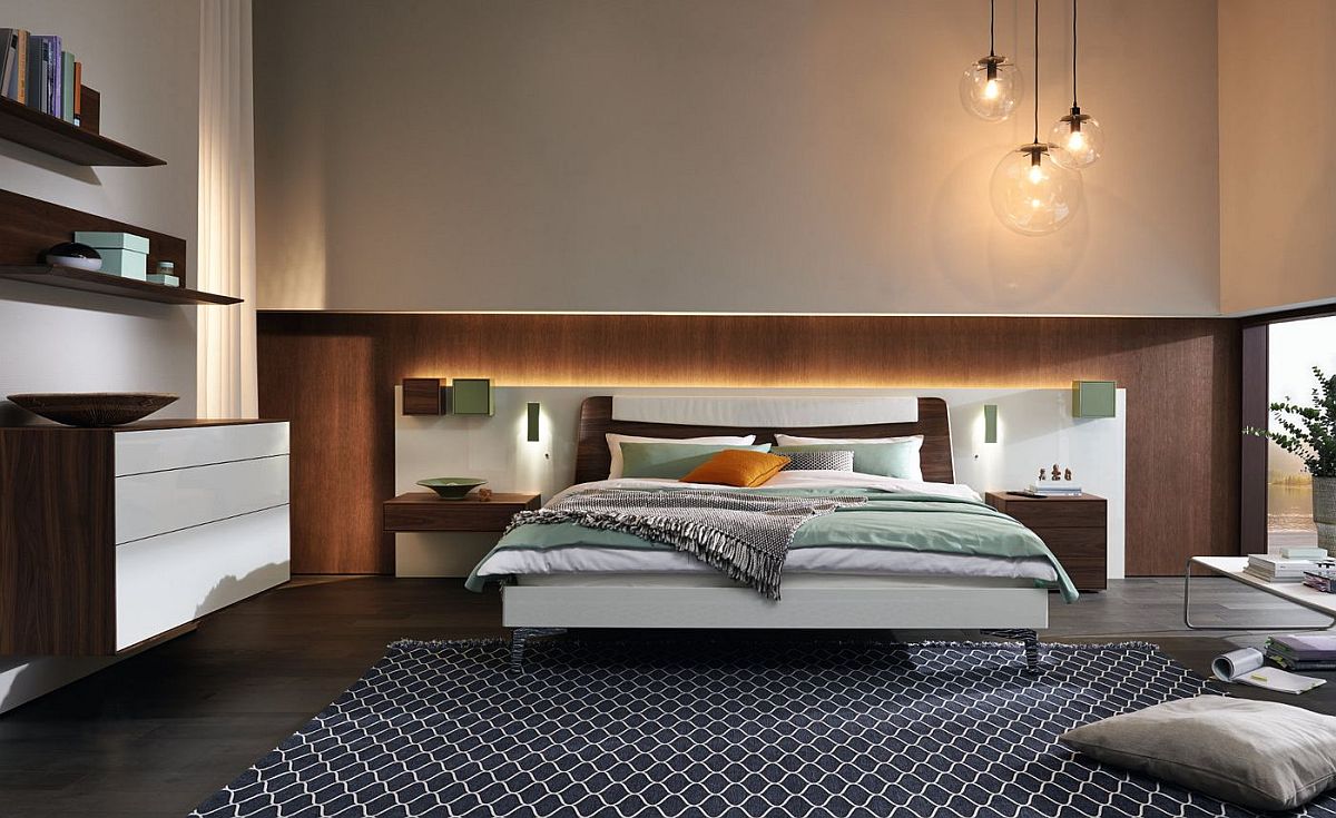 Beautifully lit headboard adds to the appeal of the bedroom