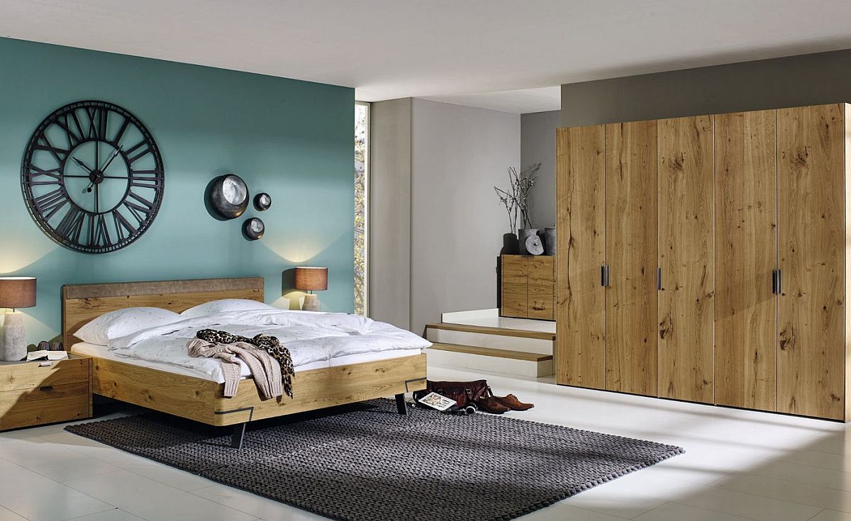 Bed, nightstand, console and wardrobe in oak create a relaxing and modern bedroom