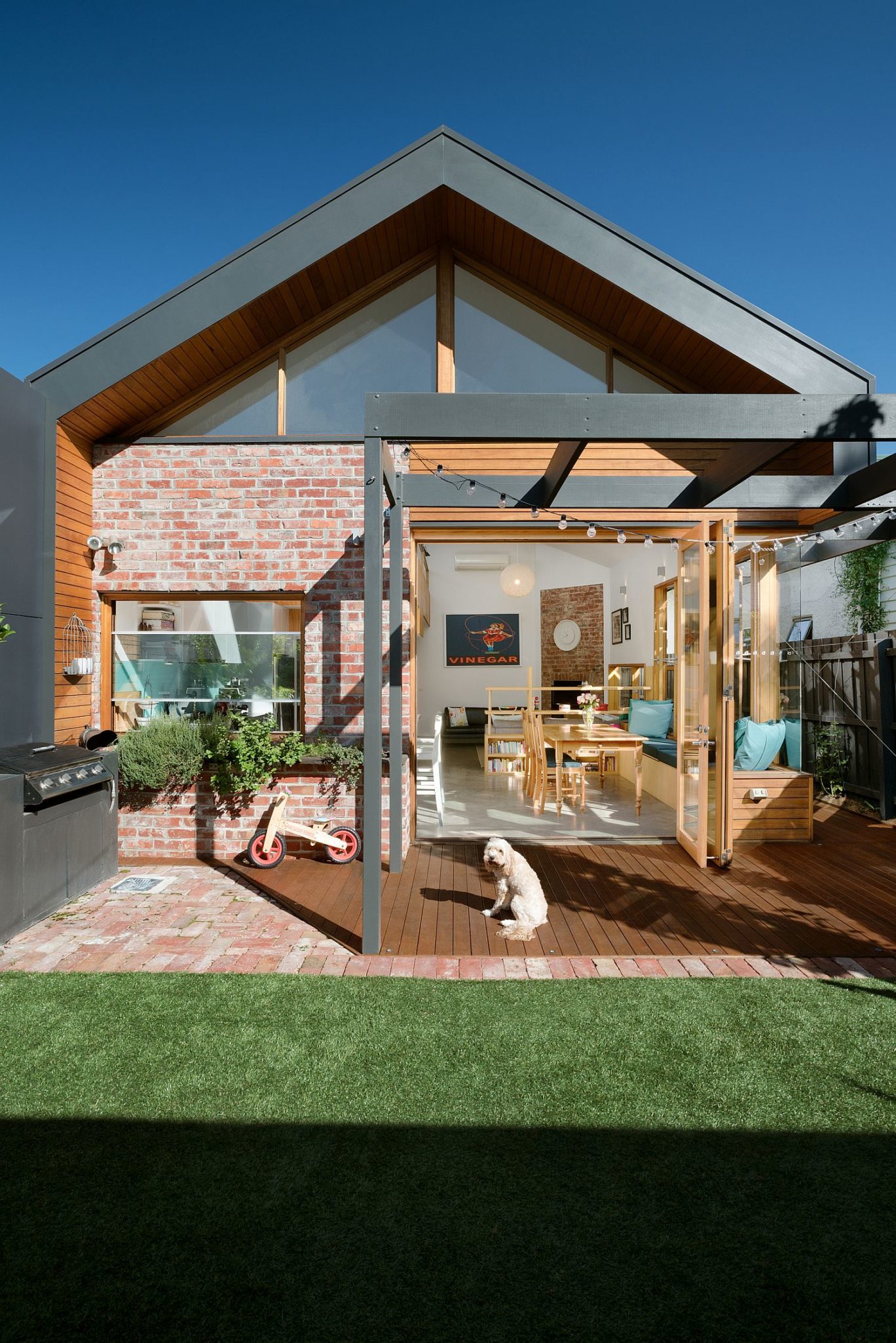 Brick, wood and gray create a unique extension for the Victorian cottage in Melbourne