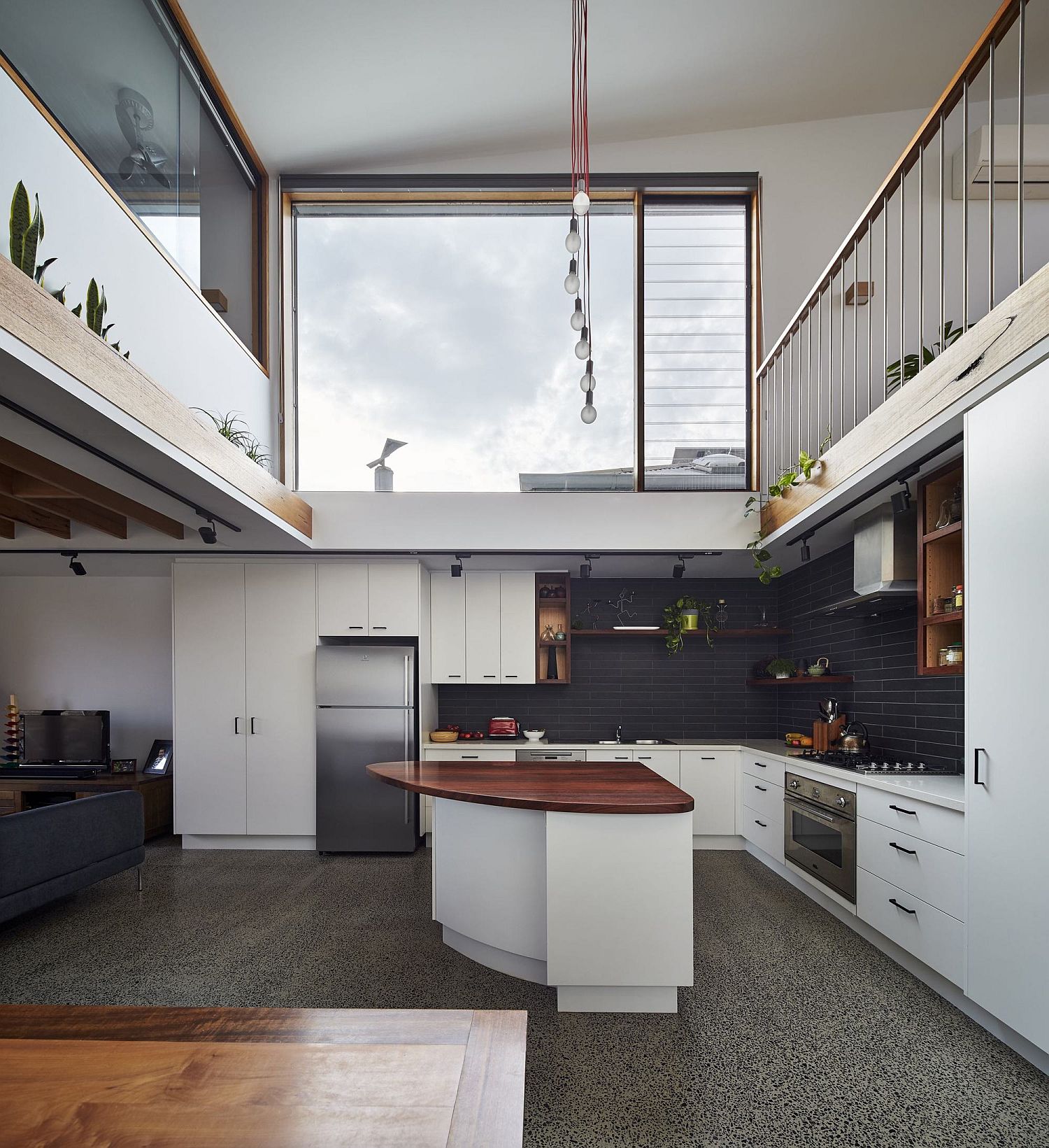 Central void of the house with kitchen and an angular island