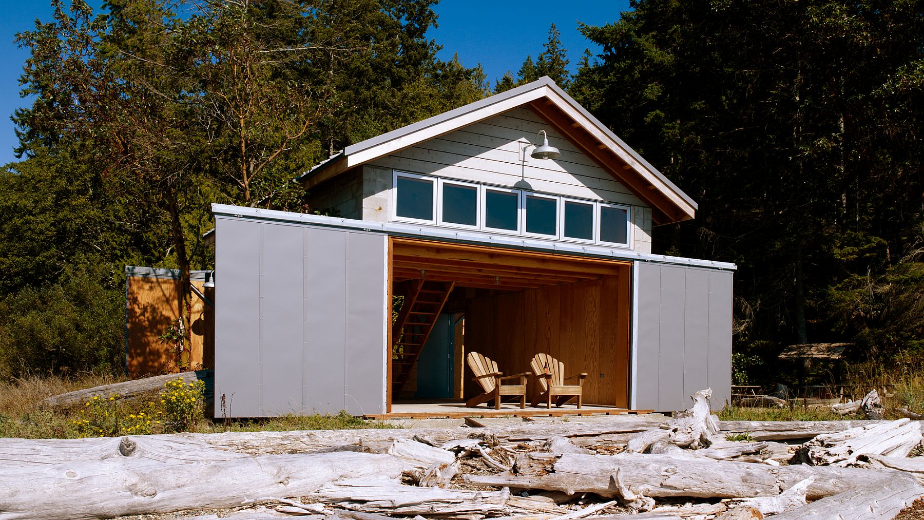 this modern boat house in winter doubles as a scenic