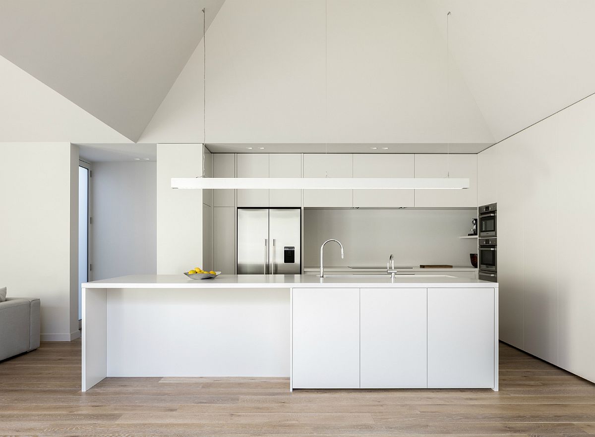 Contemporary kitchen in white with a smart island