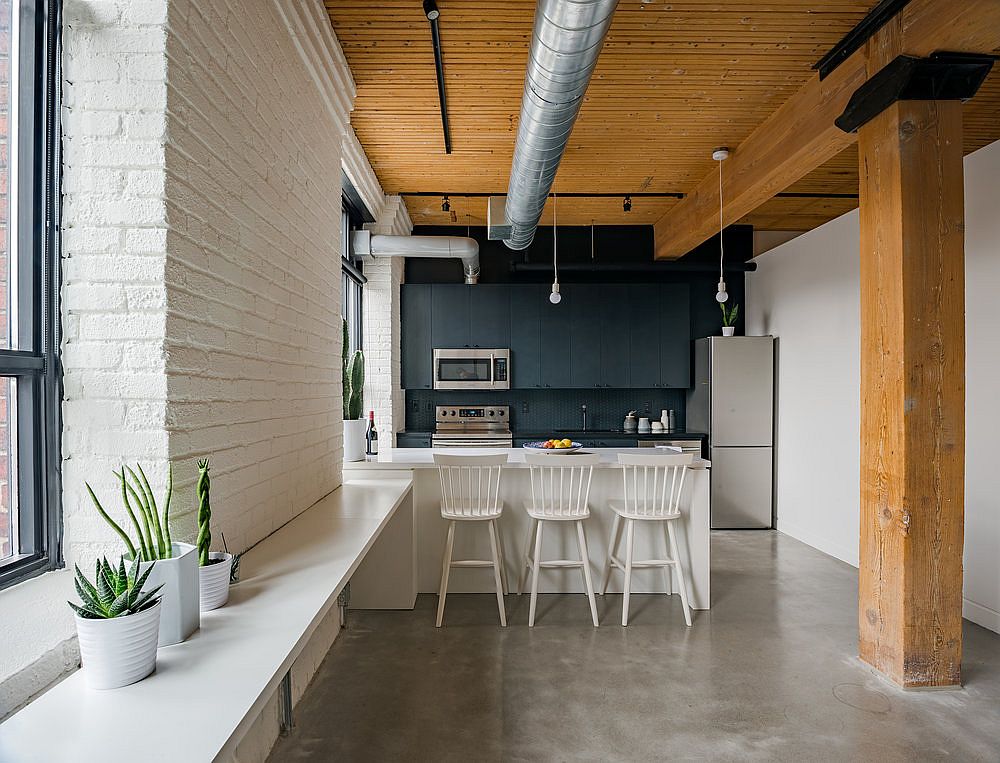 Dark accent wall in kitchen with smart shelving