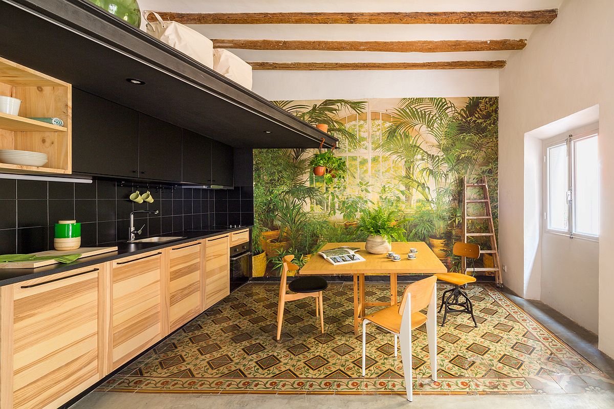 Dining area and kitchen with a vibrant and colorful backdrop