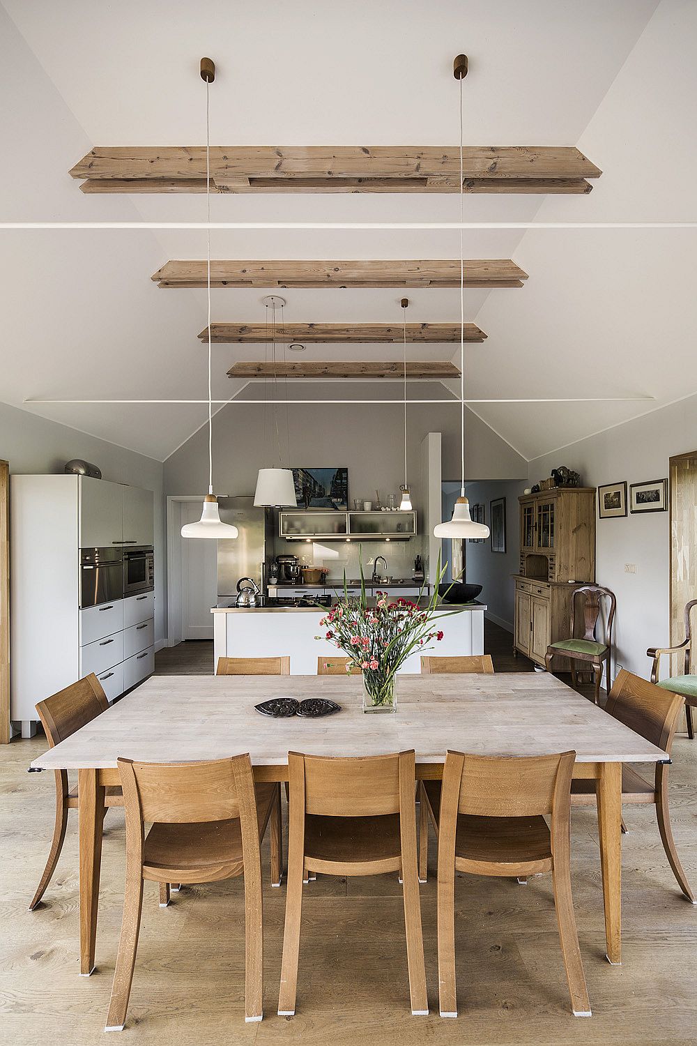 Dining area, kitchen and open living space of the Polish home