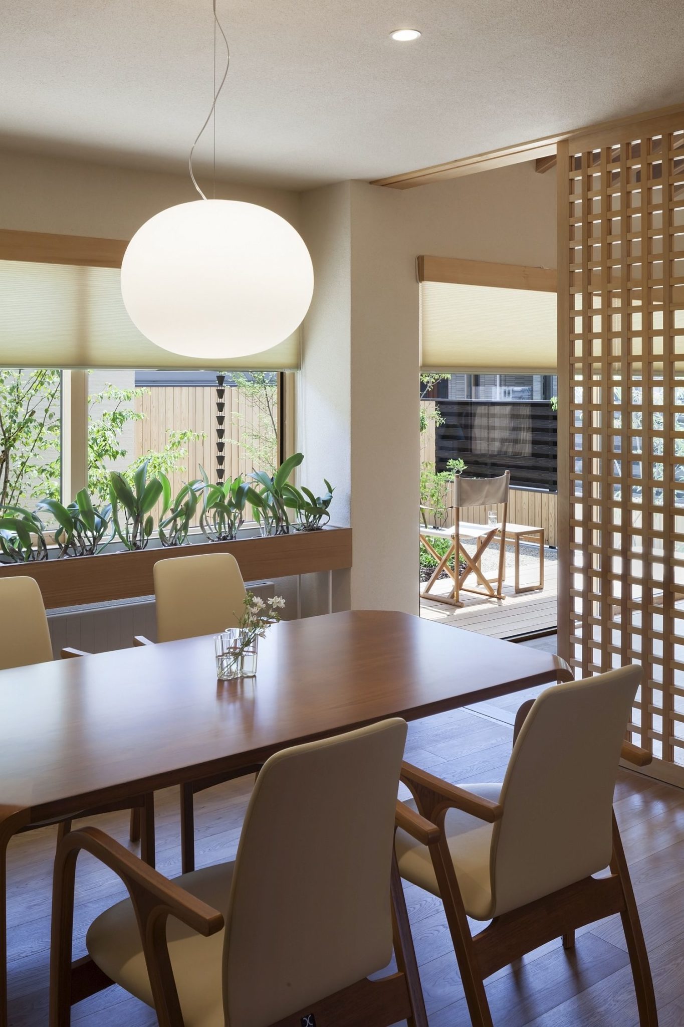 Dining area with smart pendant lighting and a cool divider