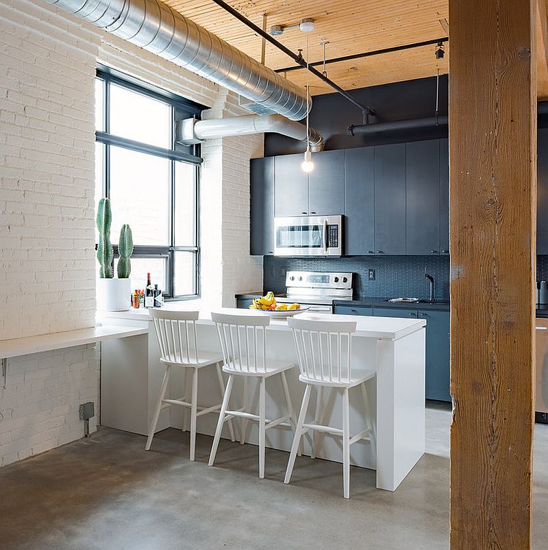 Fabulous, light-filled kitchen in white with dark accent wall