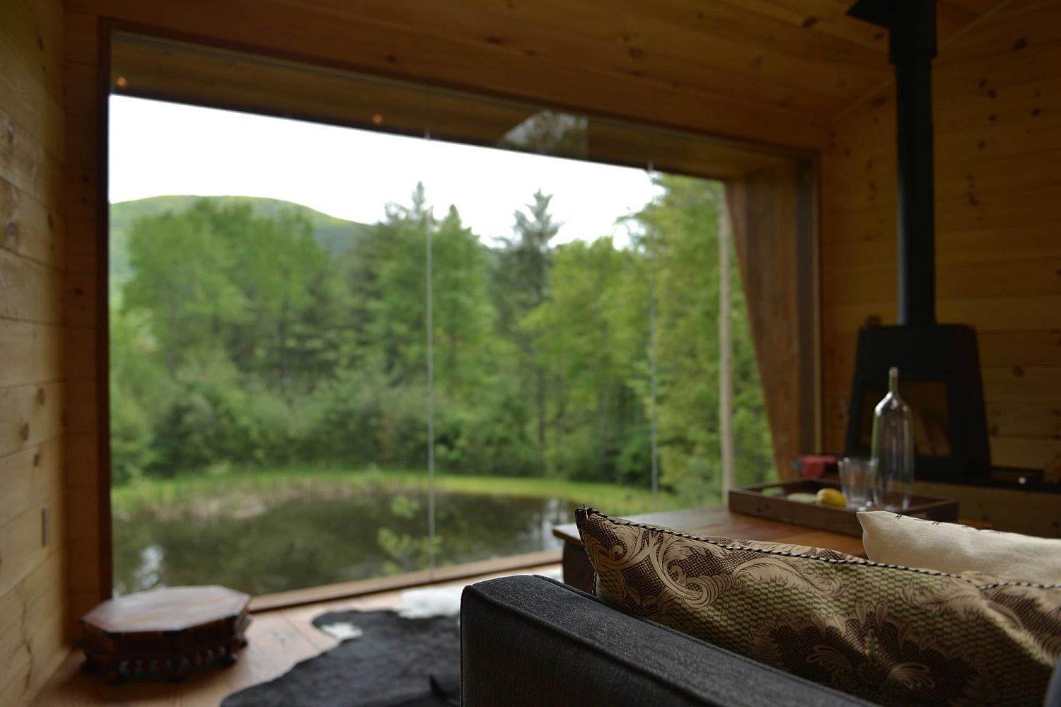 Floor to ceiling glass windows bring the views inside