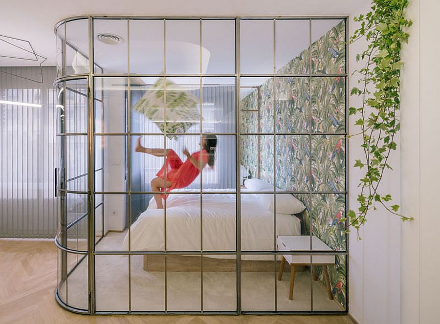 Framed-glass-walls-create-visual-connection-even-as-drapes-offer-privacy-when-needed
