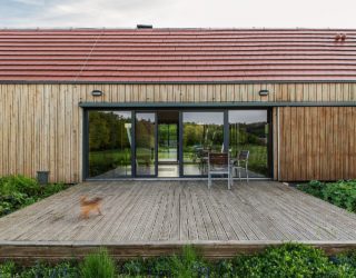 Dual Decks and a Cloak of Green: Modern Classic Home in Poland