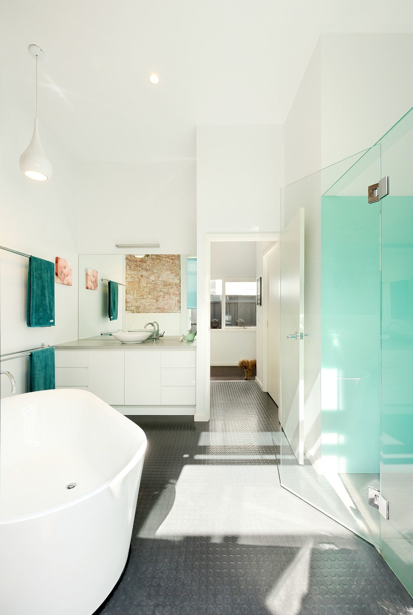 Gorgeous contemporary bathroom with non-slip floor and white walls