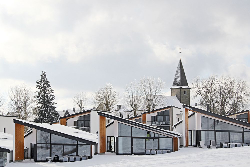 Large glass windows open up the living area to the view even while create a striking facade