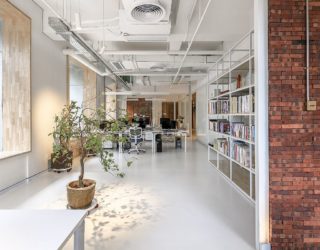 Exposed Brick and Natural Greenery Bring Freshness to this Chinese Office