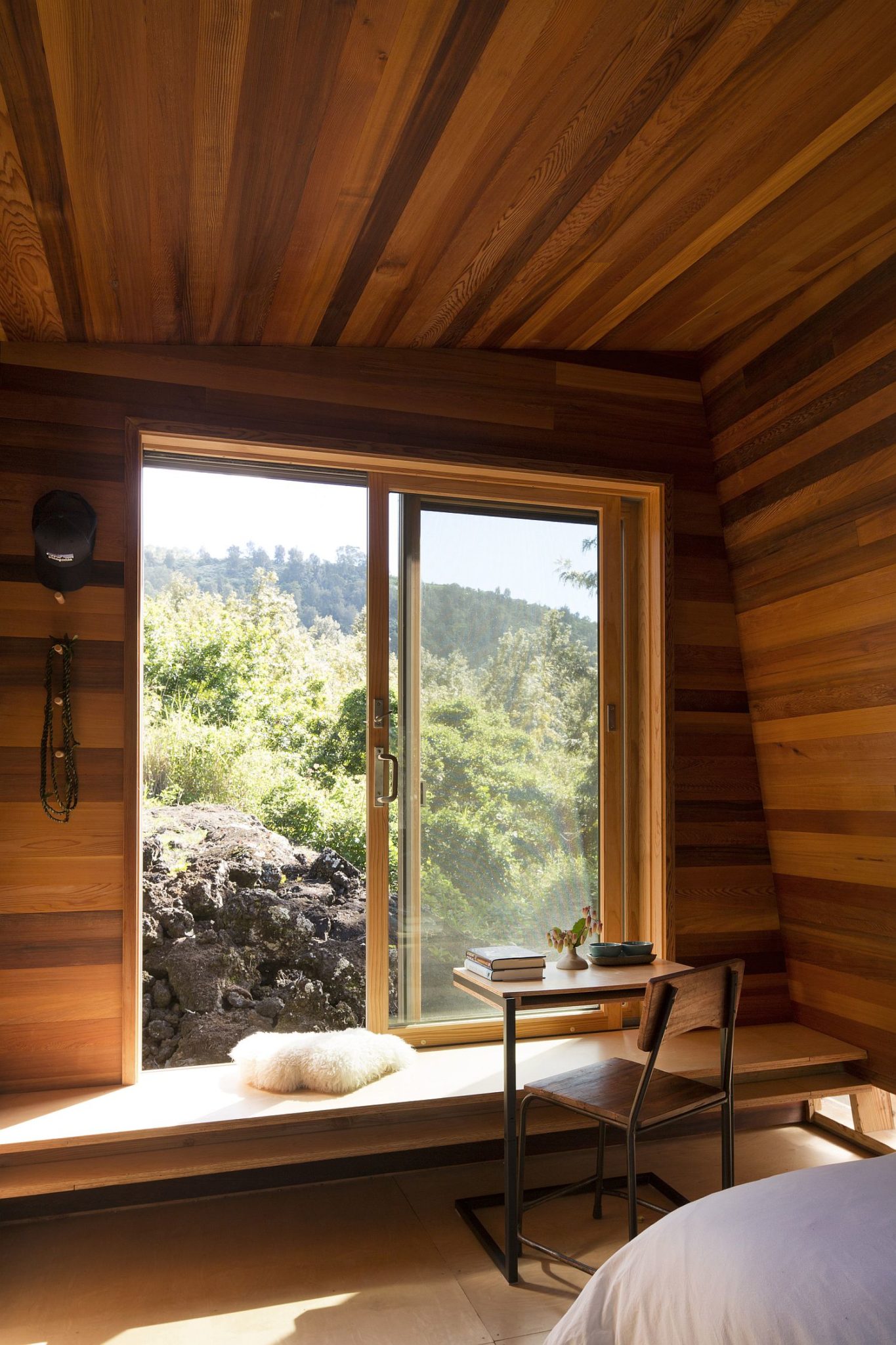 Large window of the bedroom offers wonderful views of the landscape outside