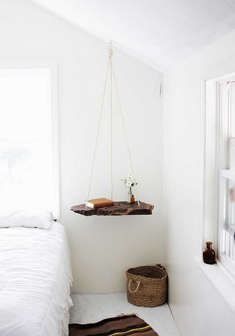 Live-edge hanging shelf used as a bedside table