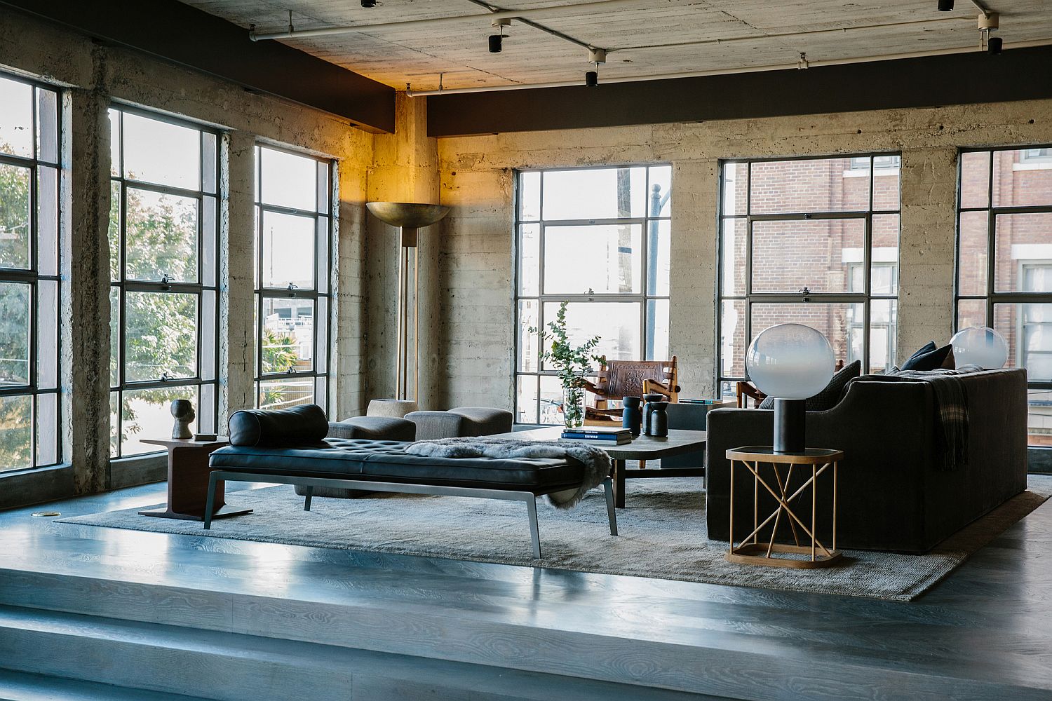 Metallic accents, modern decor and lovely lighting enliven the industrial interior