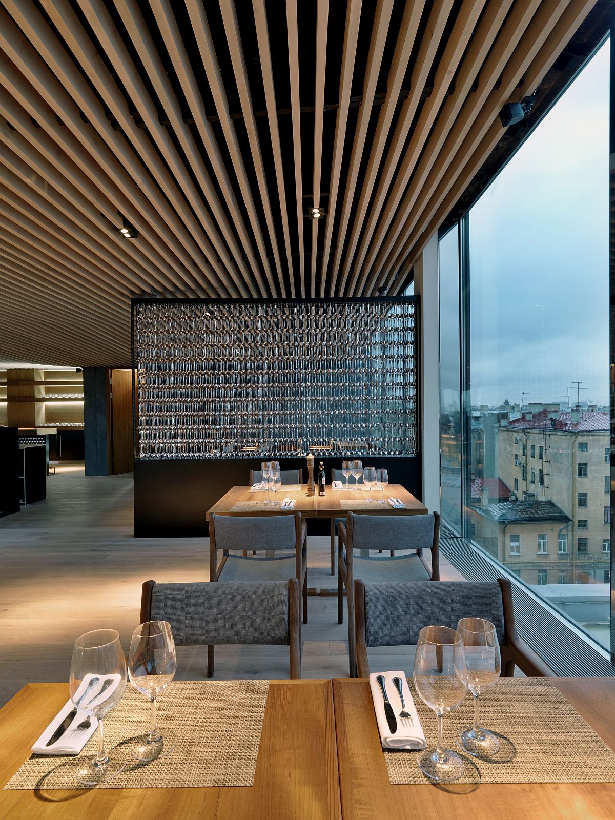 Minimal wooden tables and chairs for the restaurant