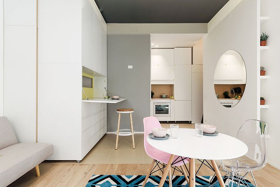Mirror gives the white interior of the micro-apartment a more spacious vibe