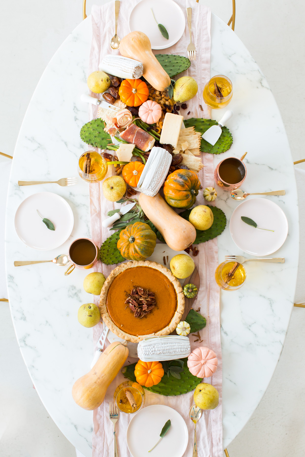 Modern Friendsgiving table with light accents