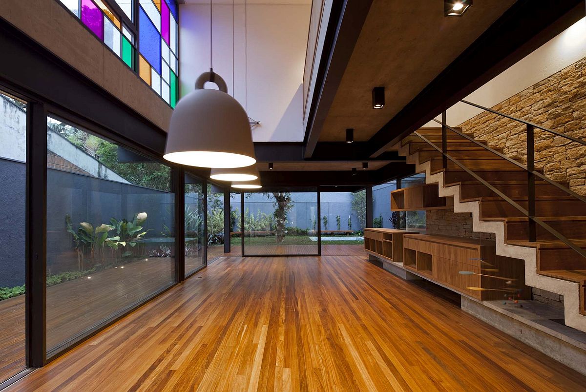 Multi-colored-glass-panes-on-the-top-level-bring-brightness-to-the-interior