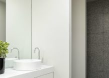 Polished-modern-bathroom-in-stone-and-white-217x155