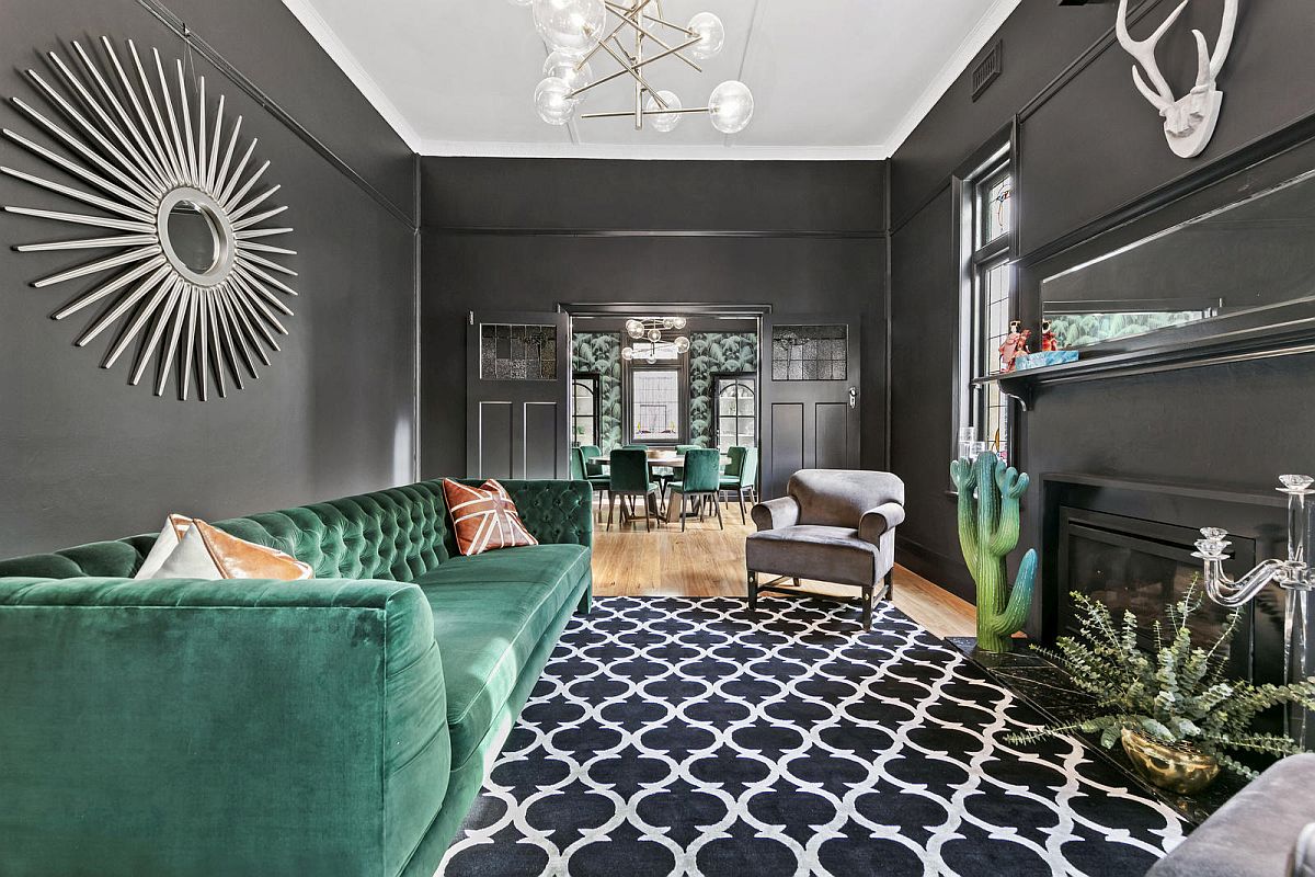 Regal living space in gray with emerald green couch and plenty of sophistication