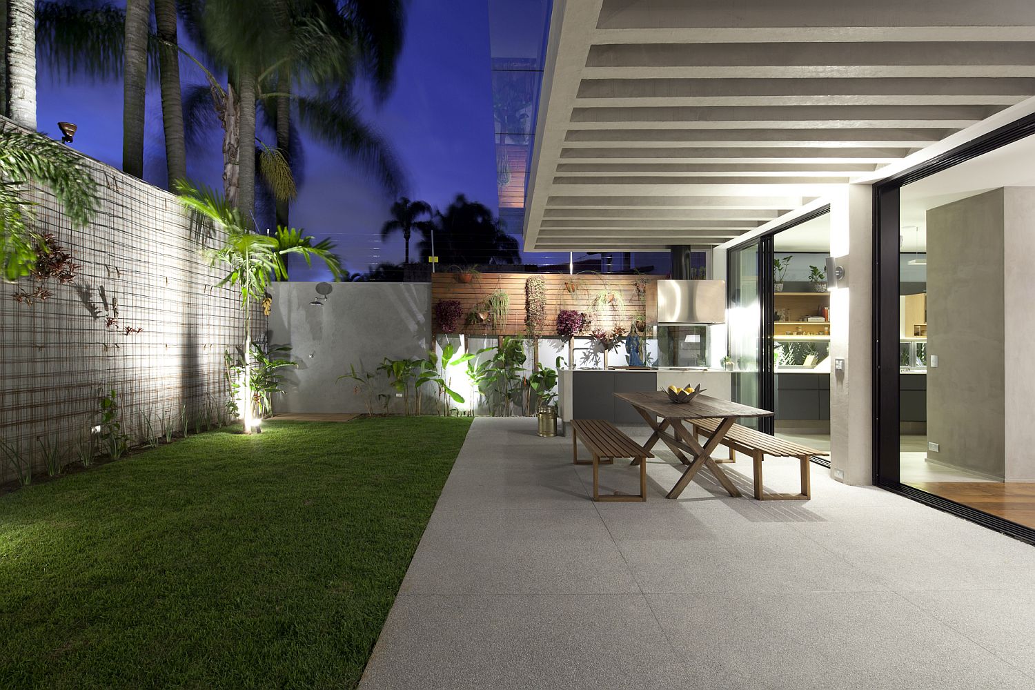 Revamped backyard with outdoor dining and plenty of greenery