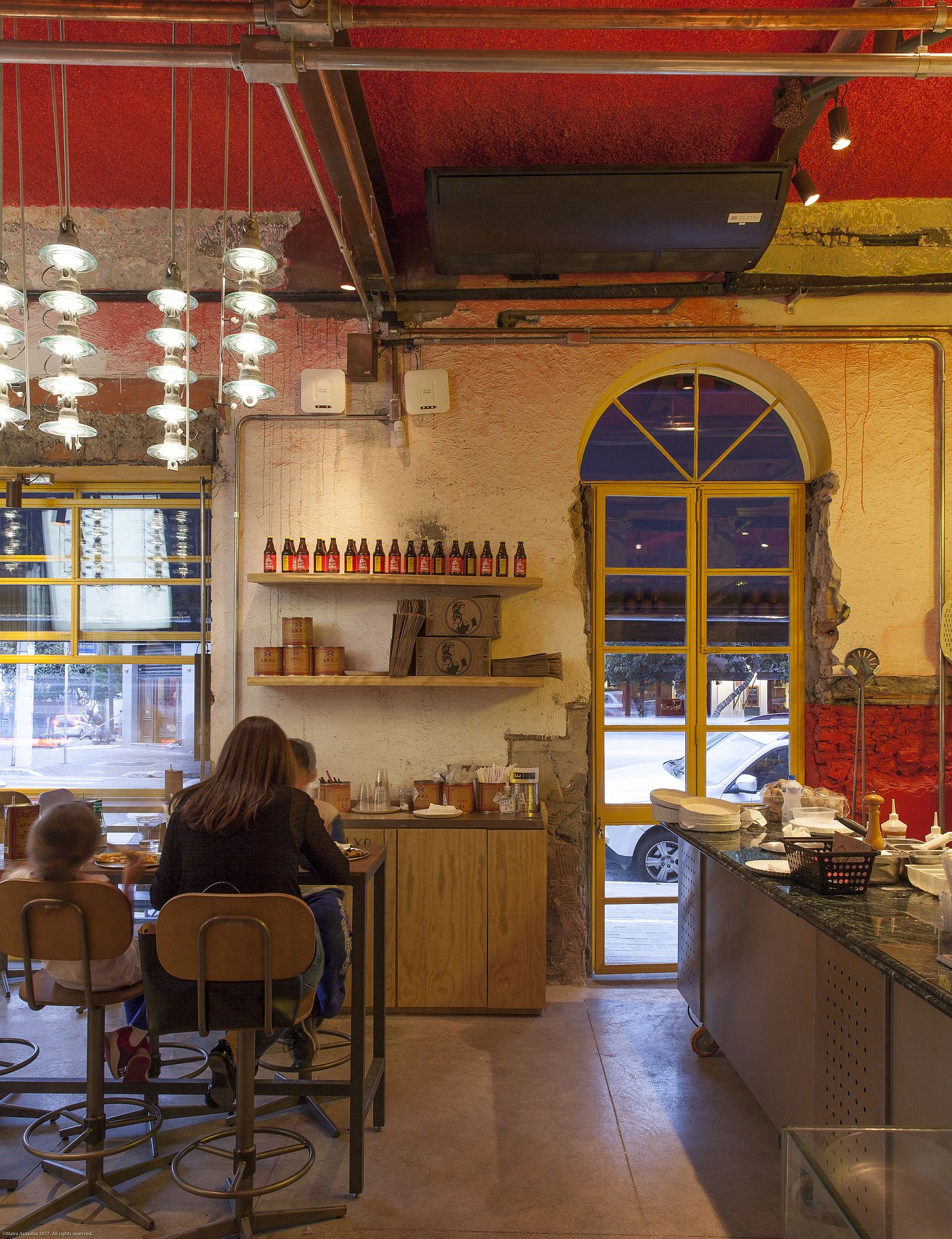 Seating inside the pizza house is designed to maximize efficiency