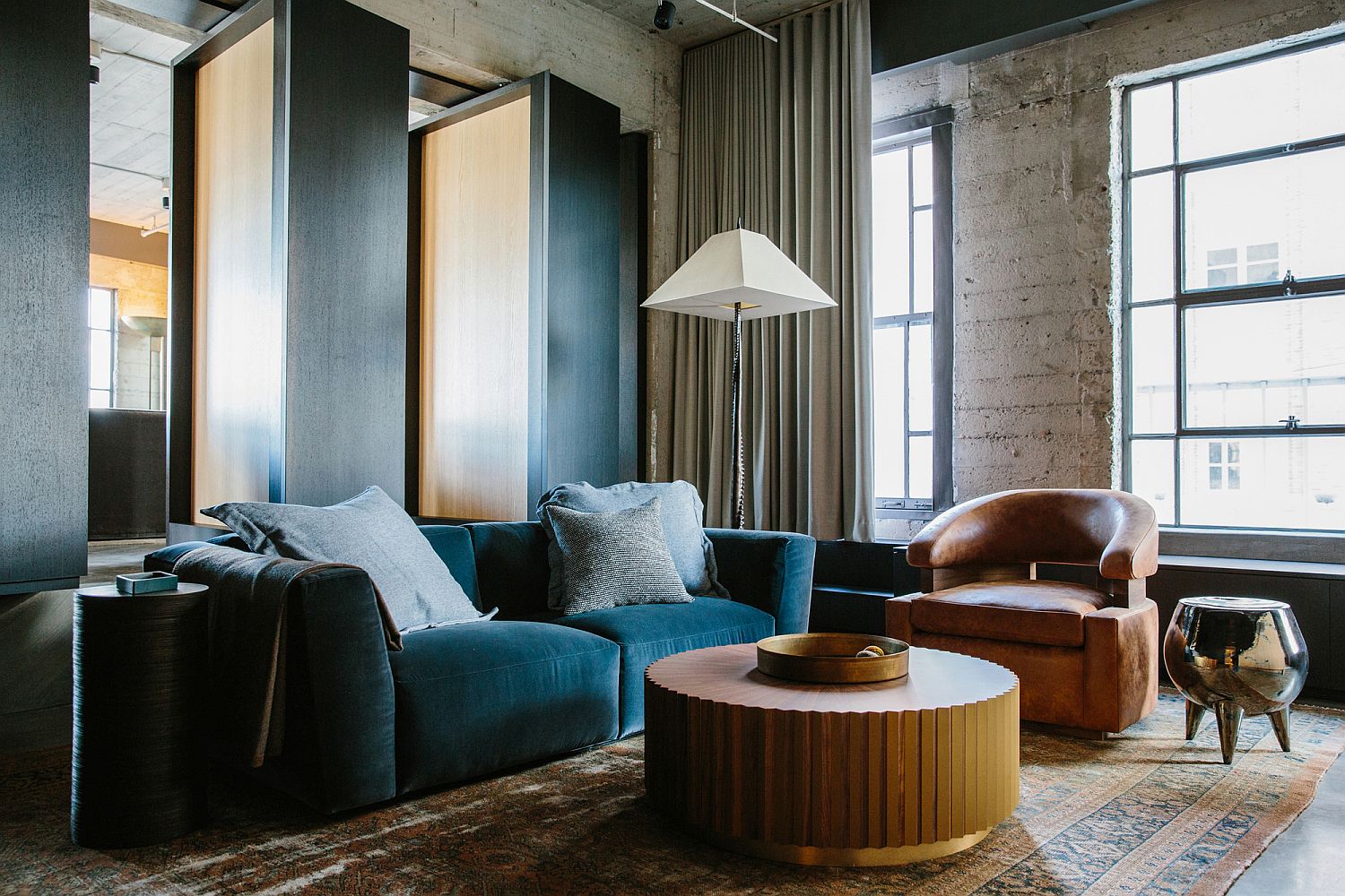 Sitting area in the master suite with rotating bookshelves that lead to the living space