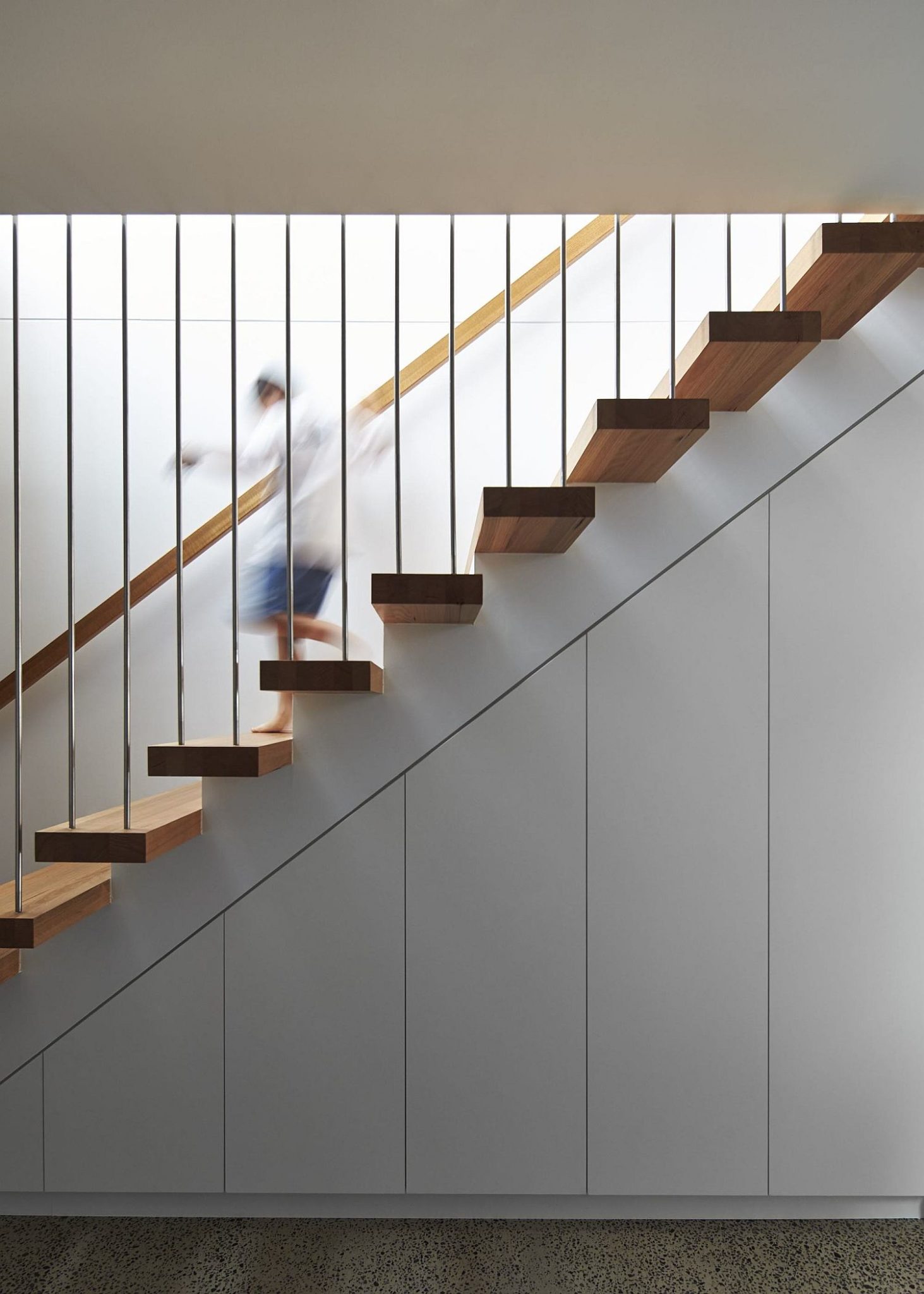 Slim floating stairway leading to the top floor