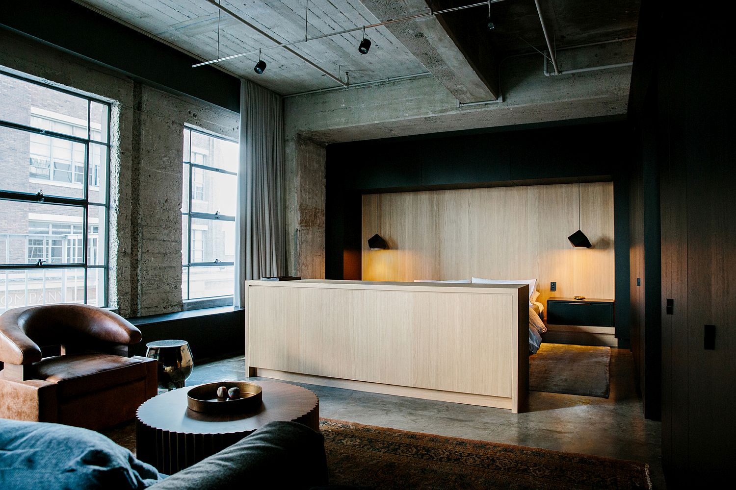 Spacious master suite of Los Angeles loft with a sitting and reading zone in the corner