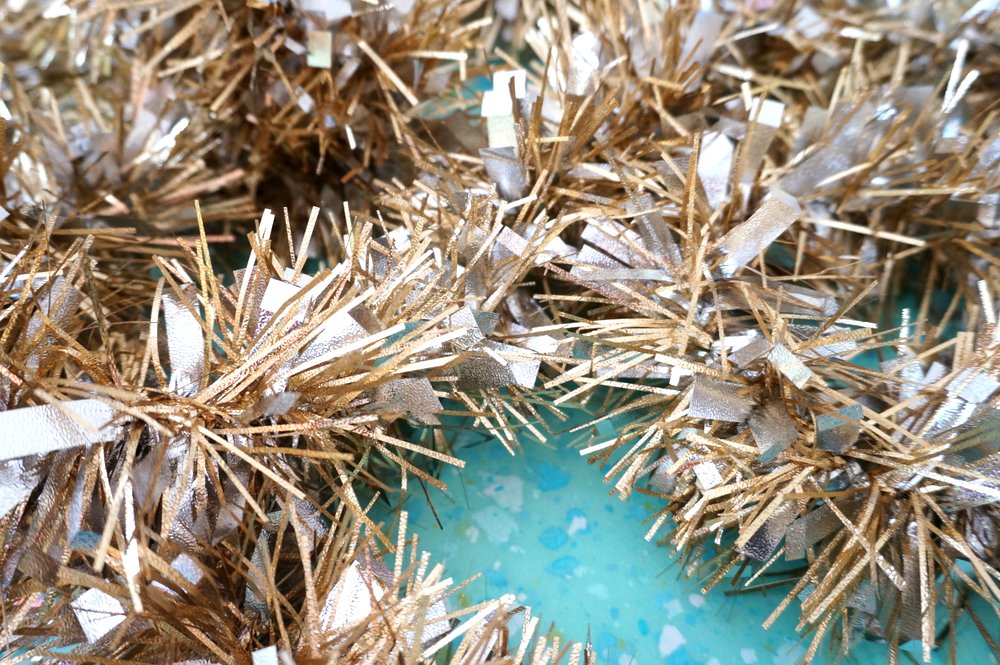 Start-with-a-gold-tinsel-garland