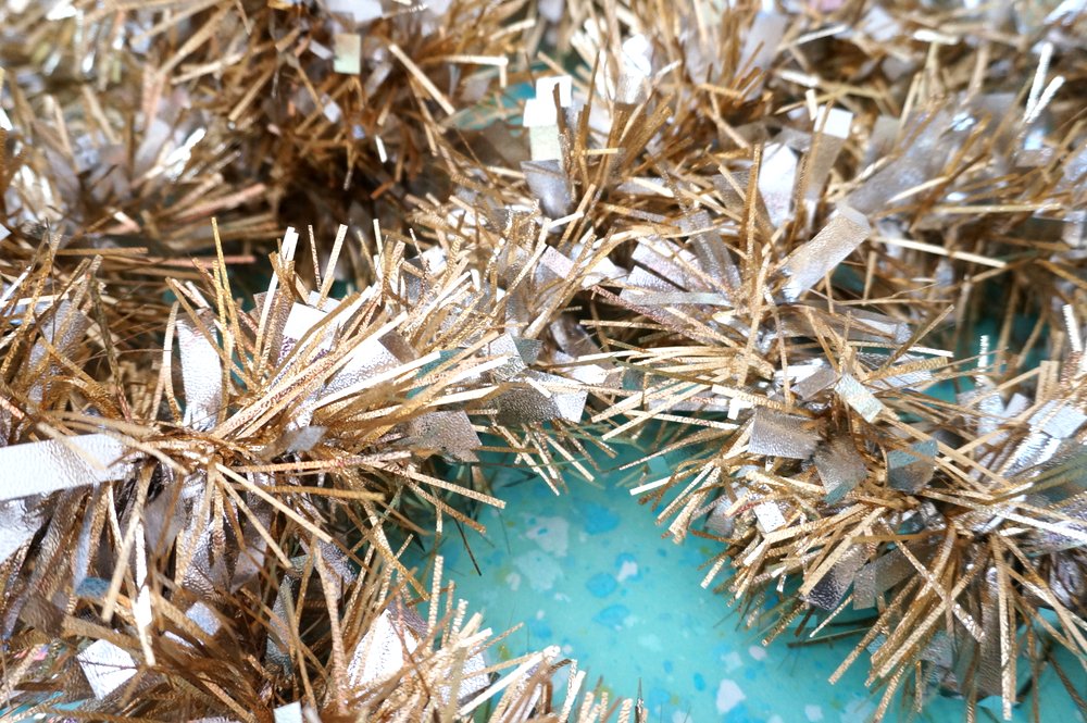 Start with a gold tinsel garland