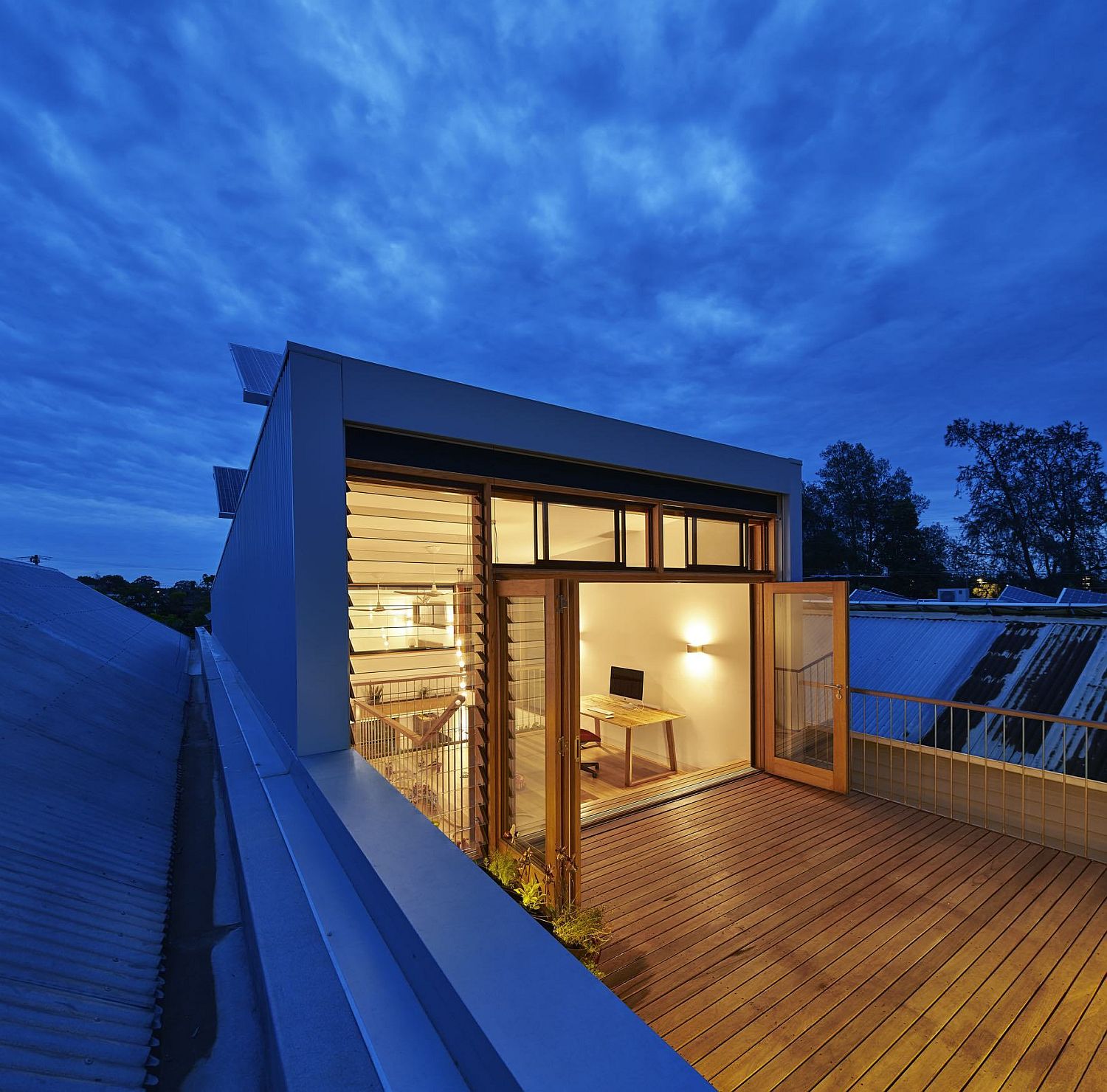 Studio on the top floor leading to the wooden deck outside