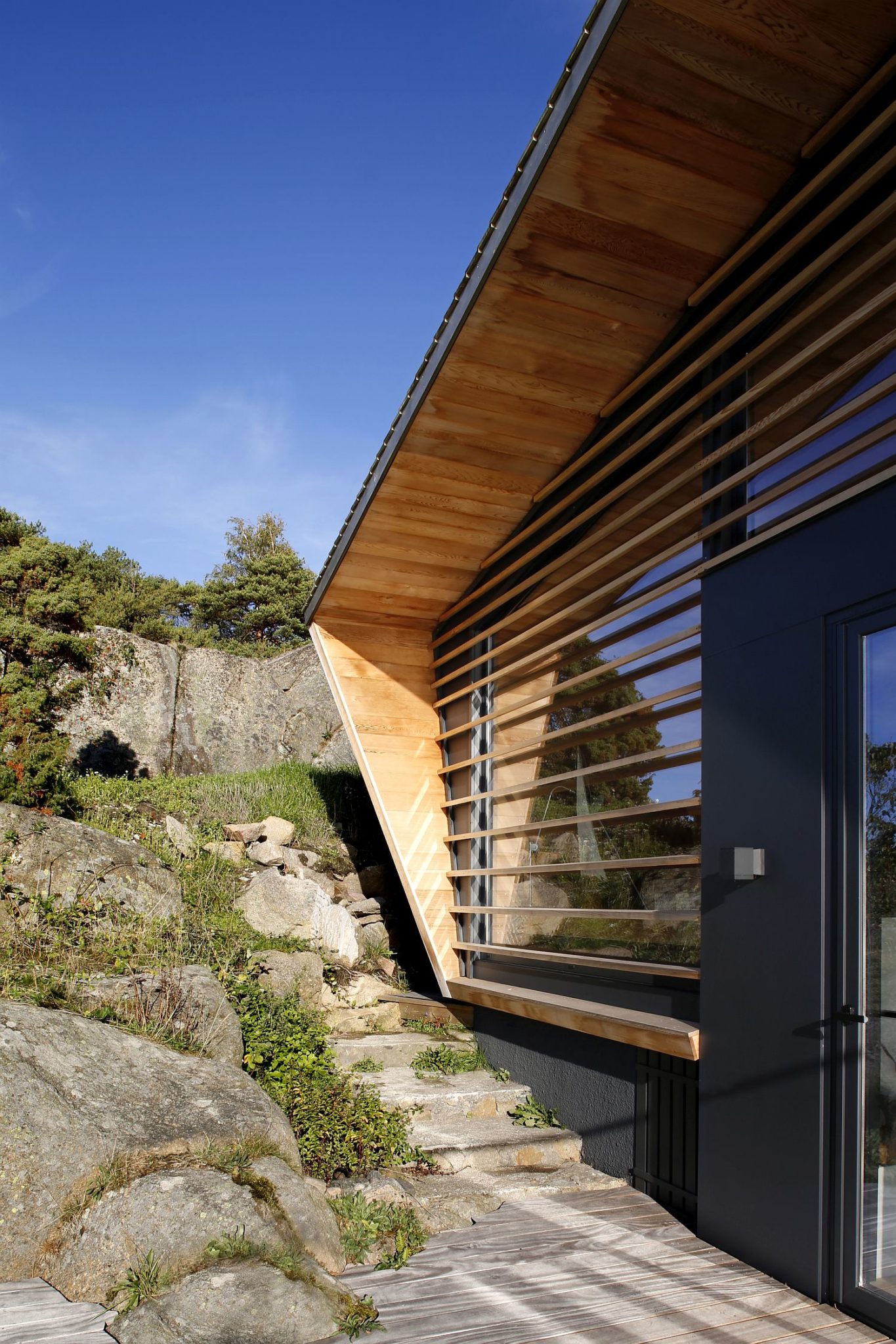 Timber slats for the windows offer protection along with ushering in filtered sunlight