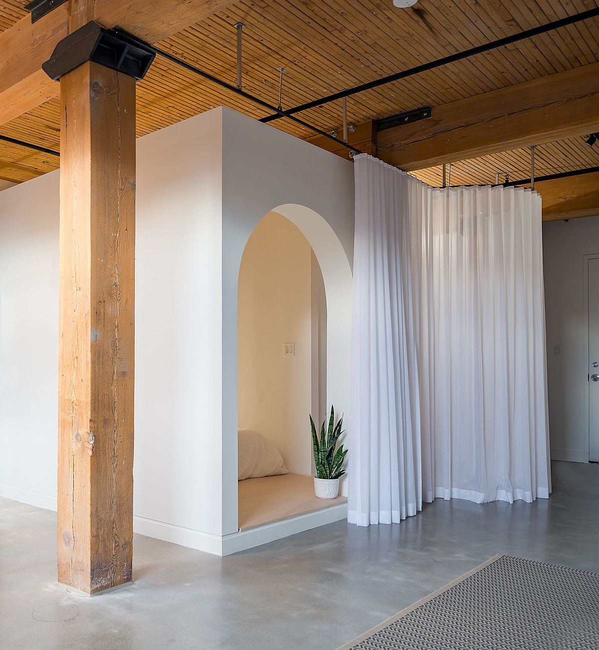 White drapes slide across to give those inside the bedroom ample privacy