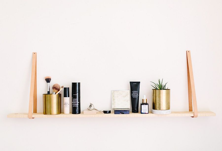 Wood and leather hanging shelf is simple and minimal