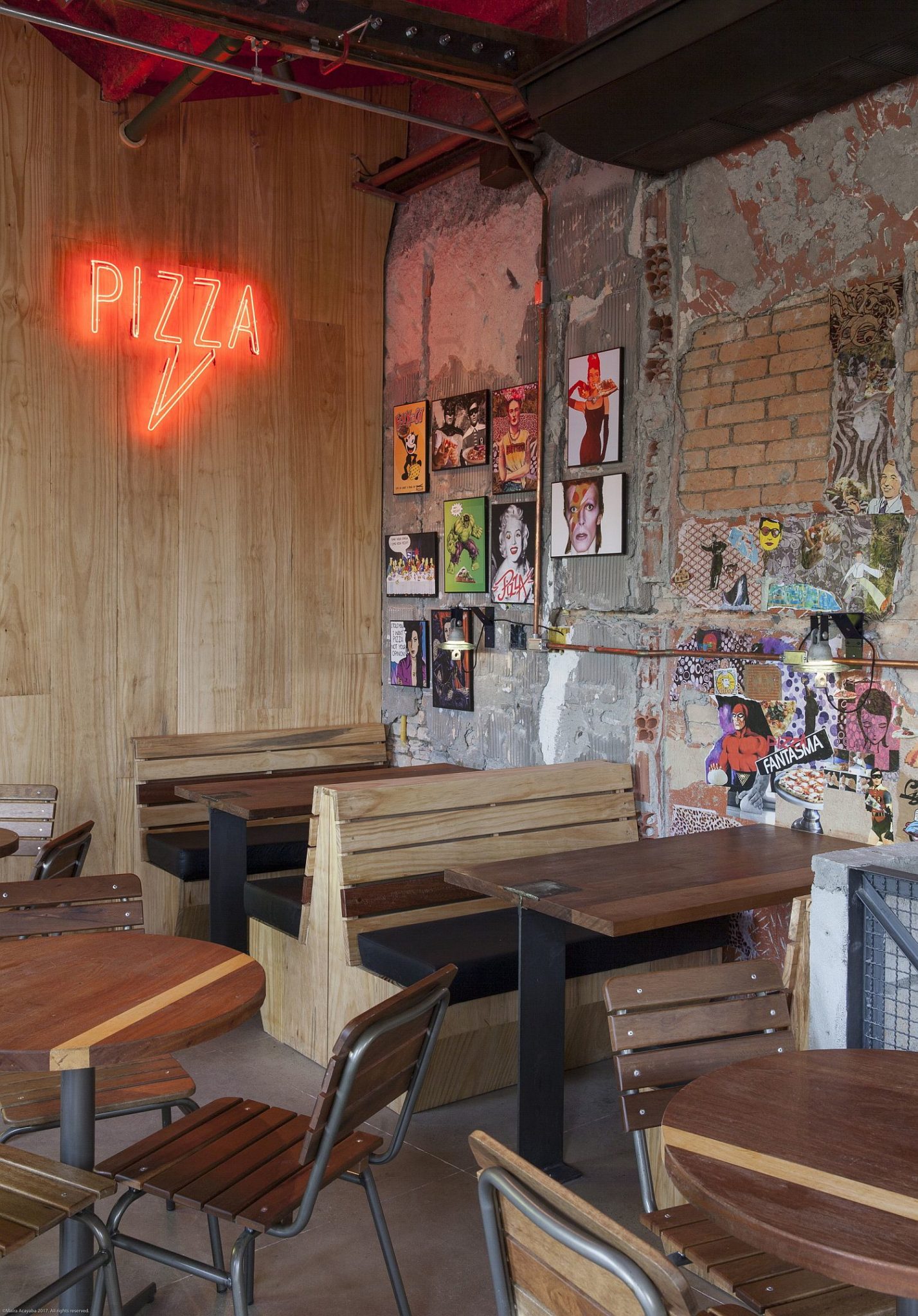 Wooden decor inside the pizza house designed to maximize space