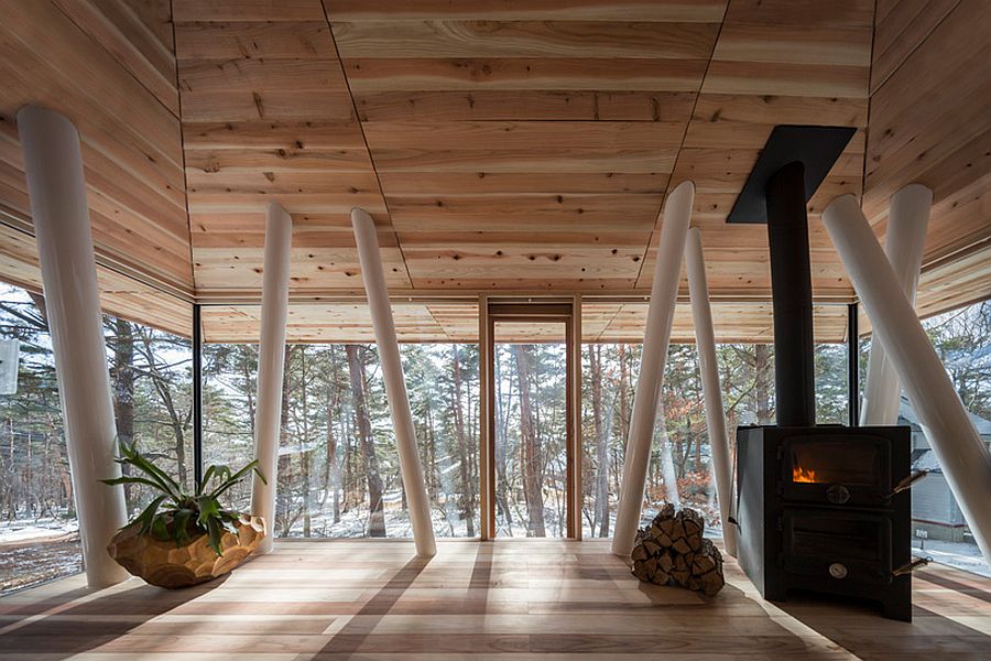 Wooden interior of the Japanese vacation home with glass window walls