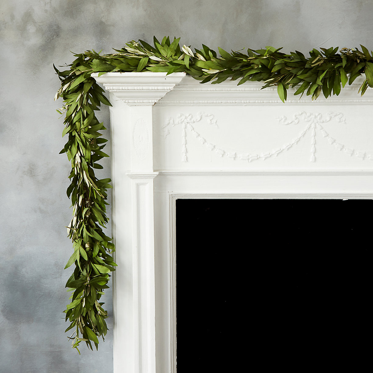 Bay leaf garland on a white mantel