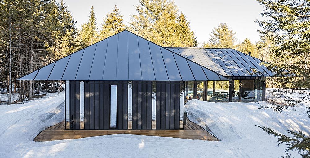 Board + Batten guest house with its distinctive roof and exterior