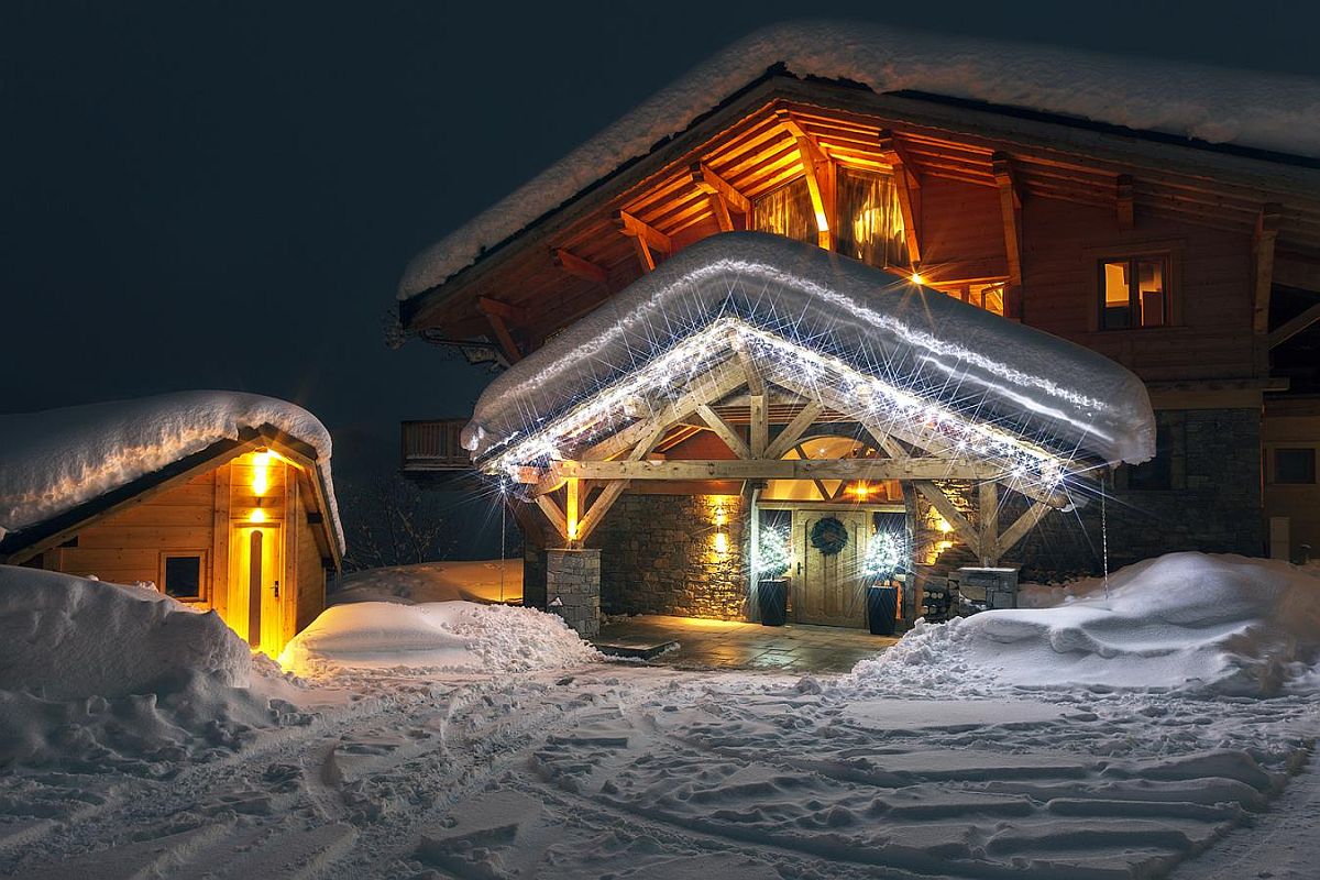 Brilliantly lit exterior of the luxurious Grande Corniche with snow-covered landscape around it
