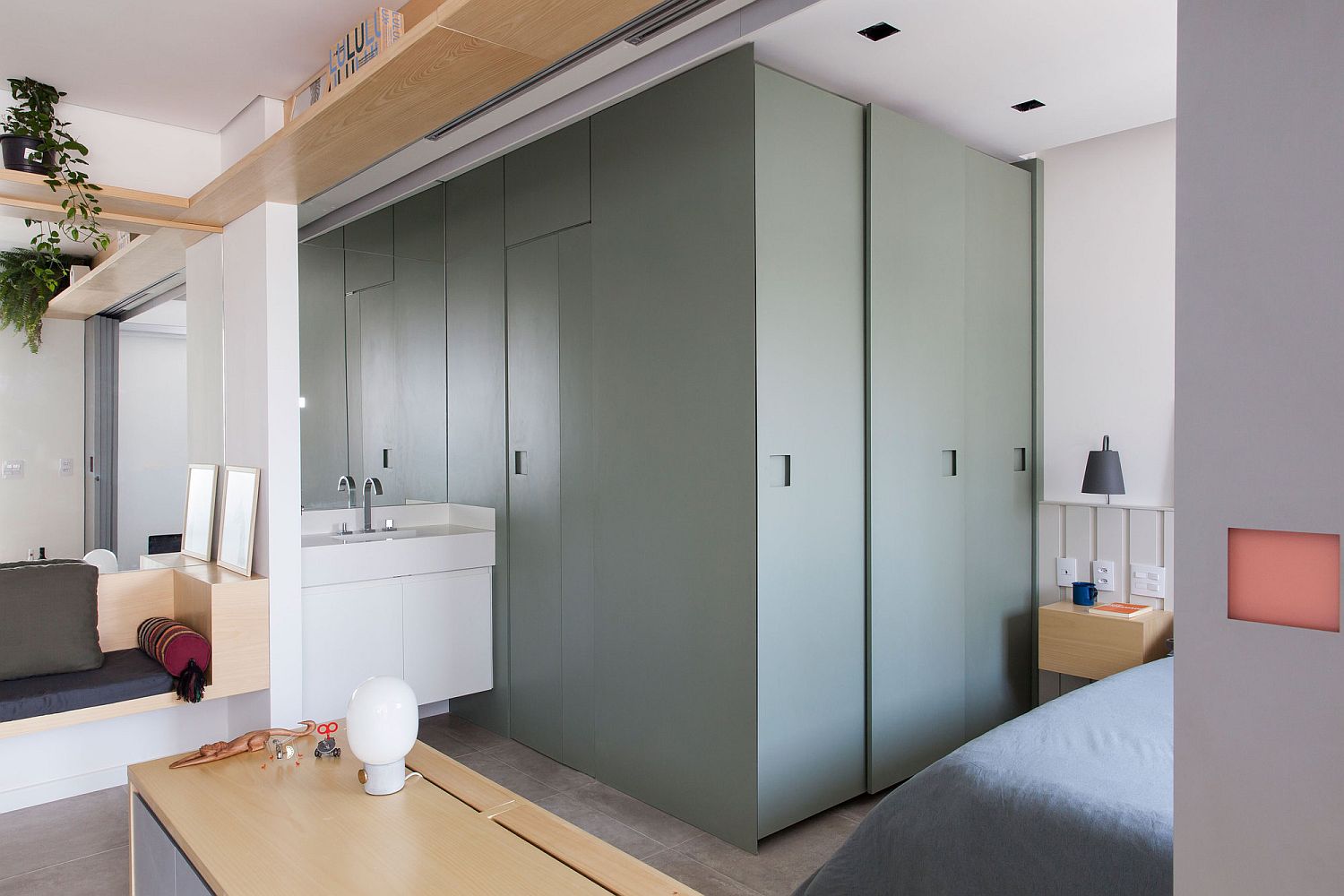 Clever hidden bedroom and bathroom behind sliding doors