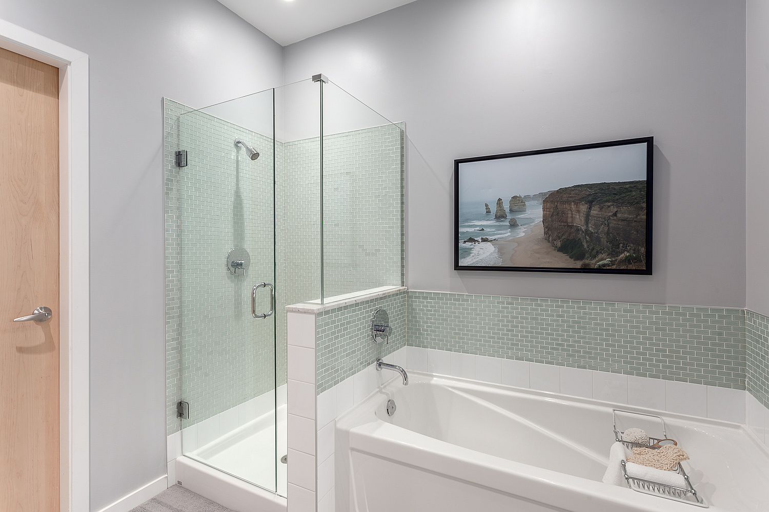 Contemporary bathroom with bathtub and glass shower in the corner