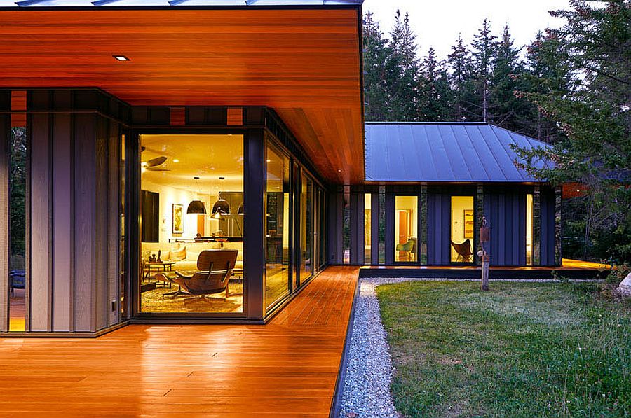 Corner-windows-of-the-Vermont-retreat-give-a-glimpse-of-the-polsihed-interior