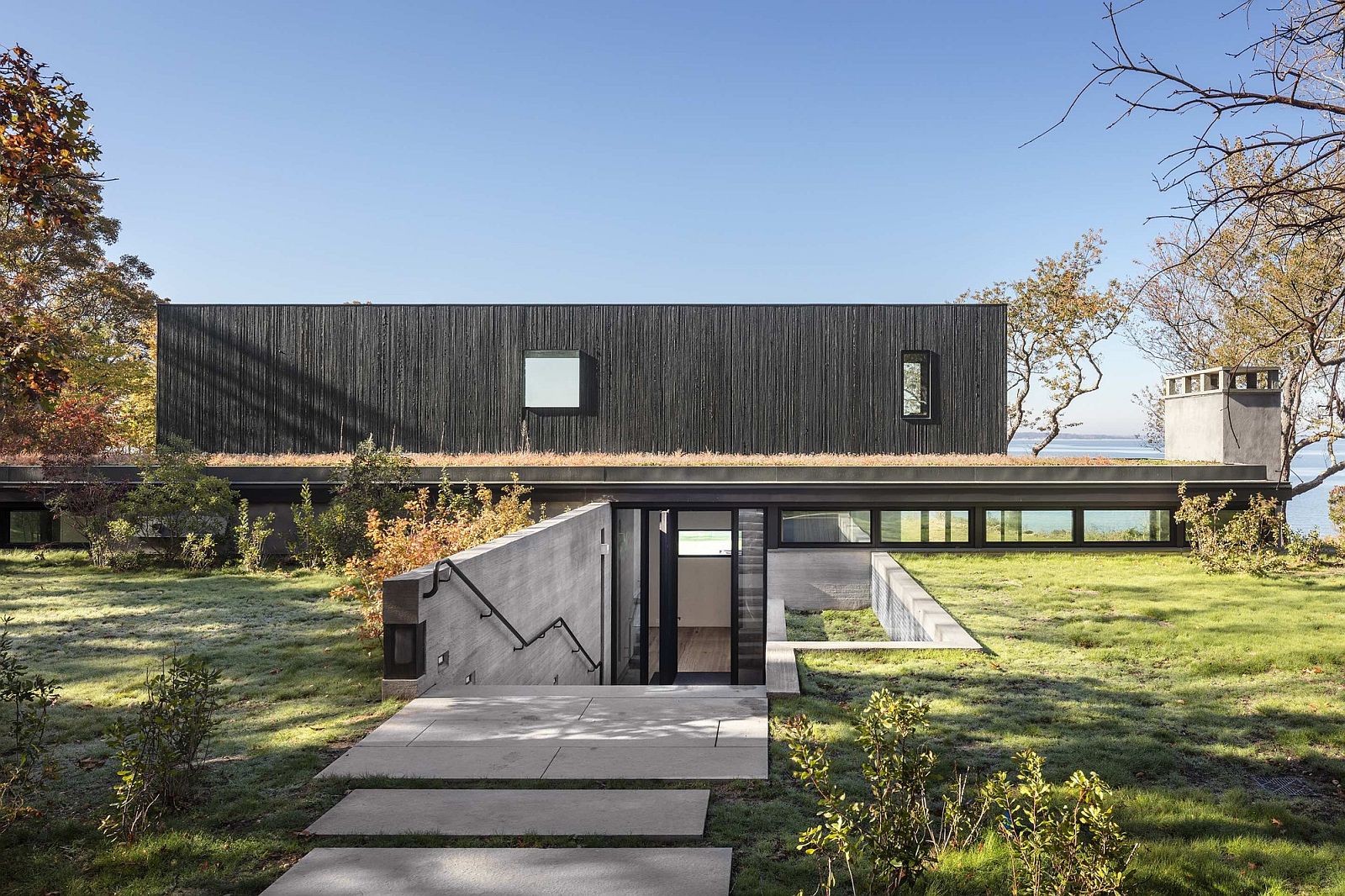 Cut in the earth creates aprivate entry to the house with Bay views