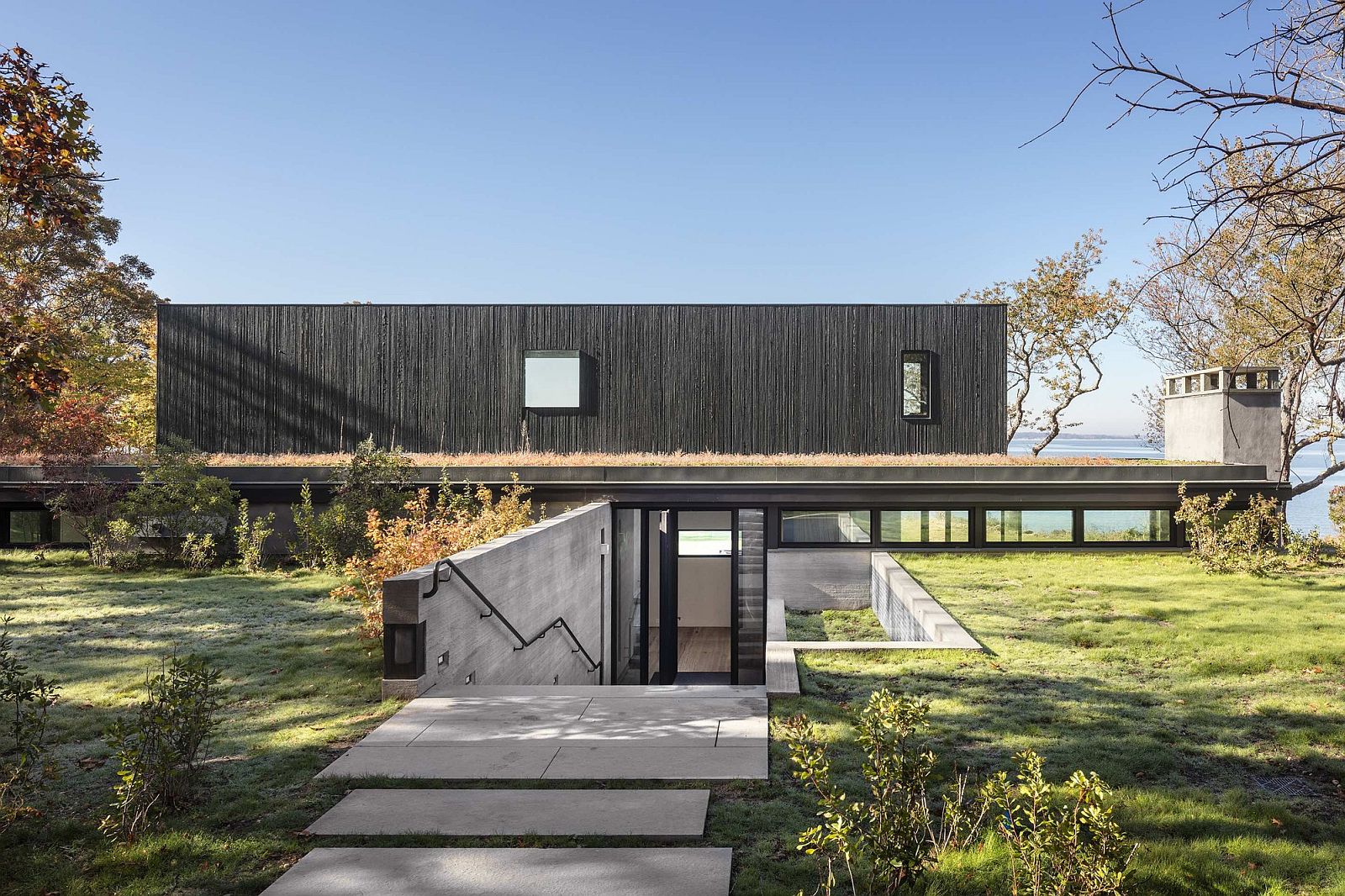 Cut in the earth creates a private entry to the house with Bay views